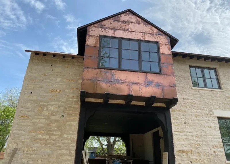 Copper metal panel facade on a stone building for Metal Roof Coating in Palm Beach